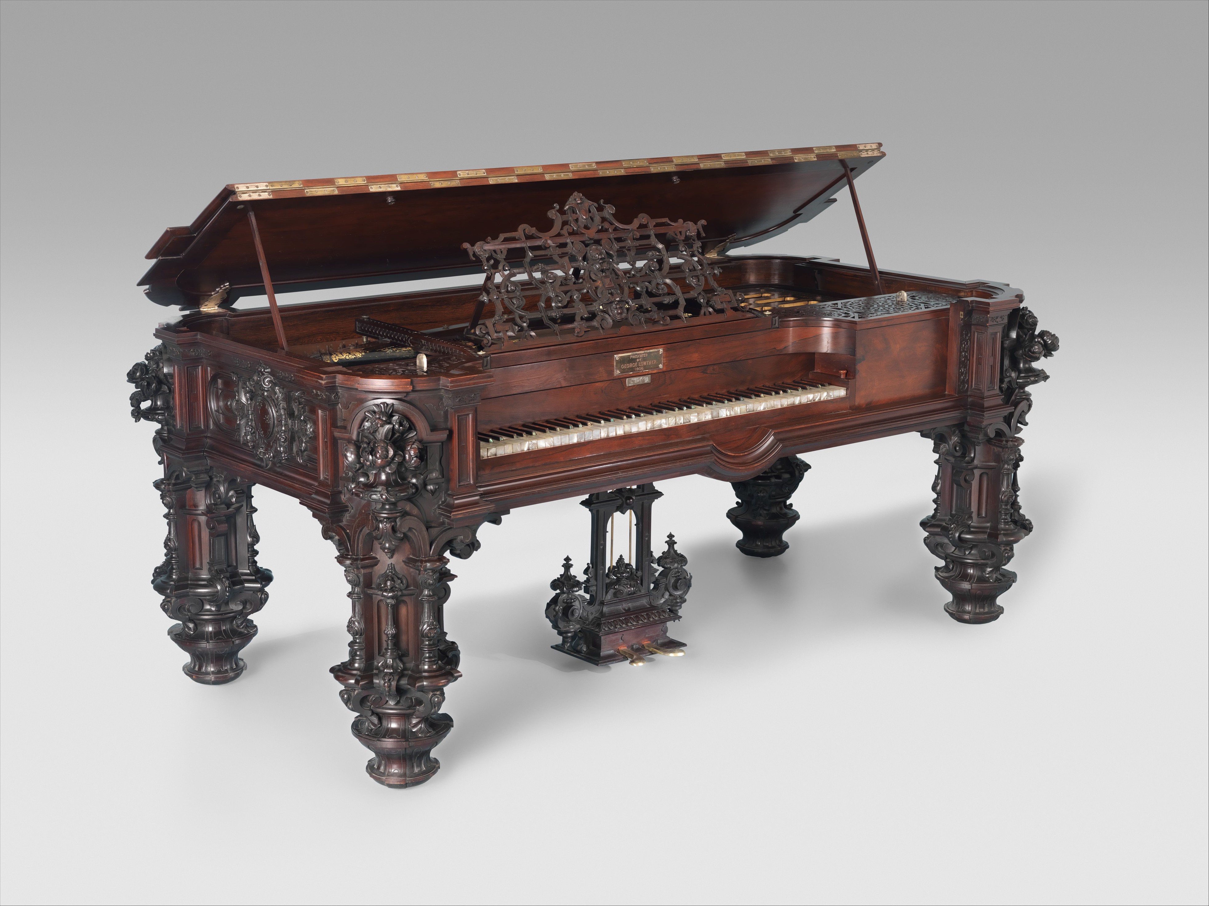 An 1853 square grand piano: a low rectangular horizontal case with keyboard and legs
